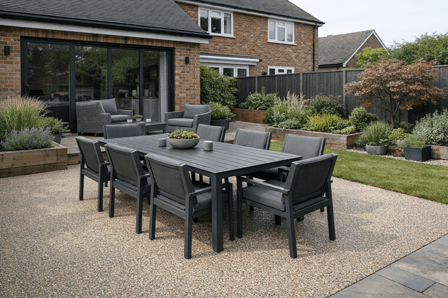 Modern resin bound patio with outdoor dining furniture in a contemporary garden
